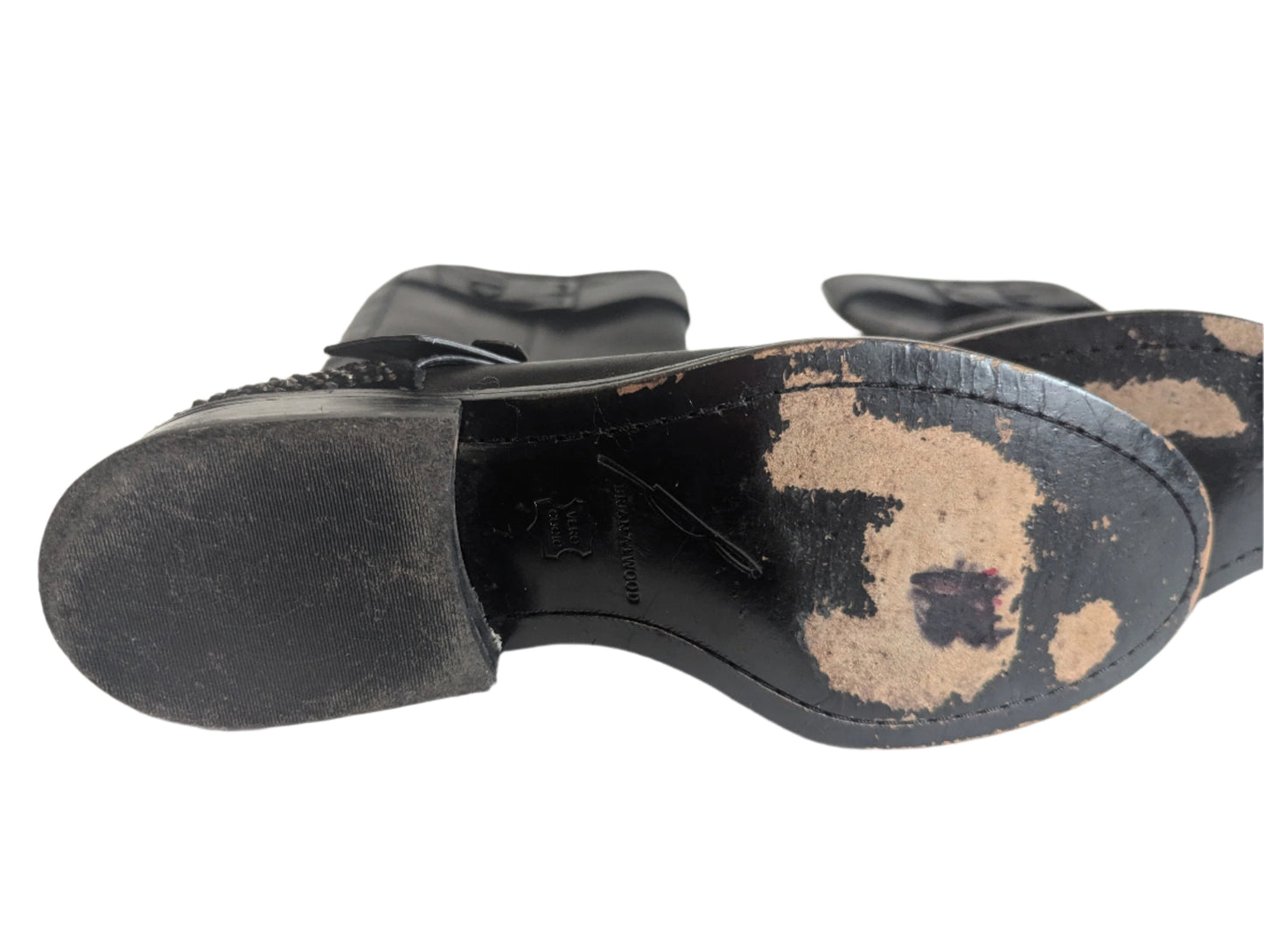 Close-up view of the interior leather insoles featuring the authentic gold Brian Atwood designer brand logo stamp.