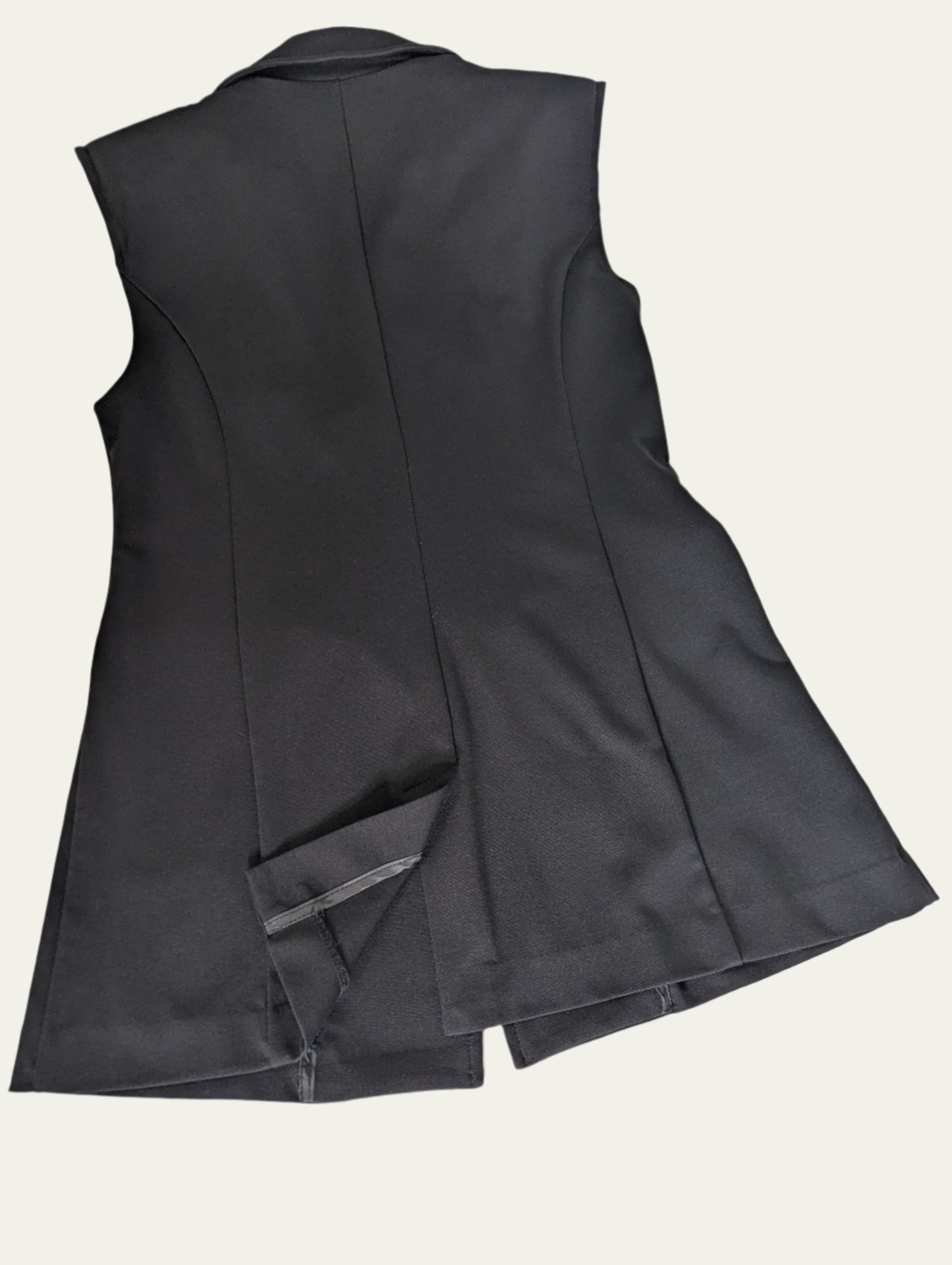 Back view of the black ICHI sleeveless vest, highlighting the sleek, structured fit across the shoulders.
