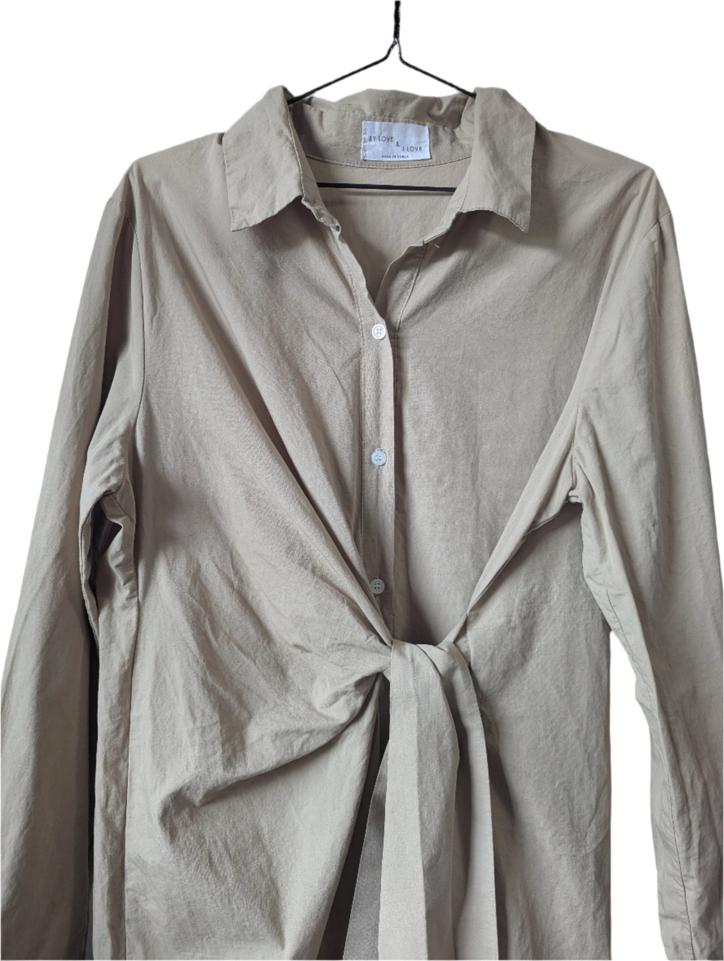 Detailed close-up view of the front button-down closure and flattering attached waist tie on the khaki Love and J Love dress.