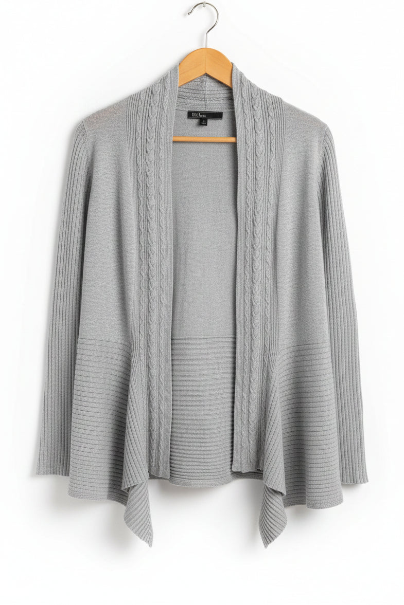 Front view of a grey ribbed 89th & Madison open front cardigan with a shark bite hem hanging on a hanger.