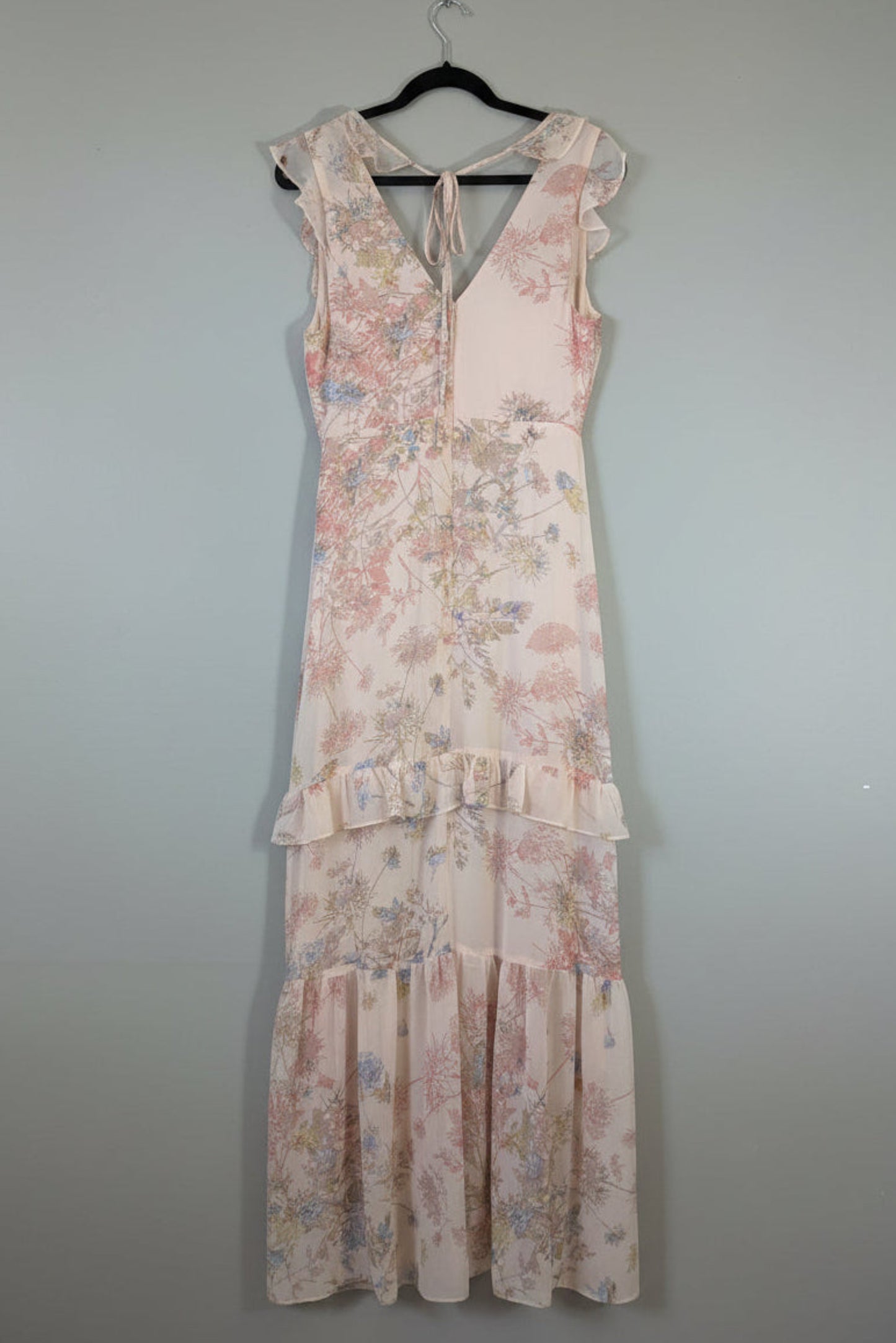Back view of the pink floral BCBGMAXAZRIA dress, showing the elegant rear tie neck detail and hidden zipper closure.