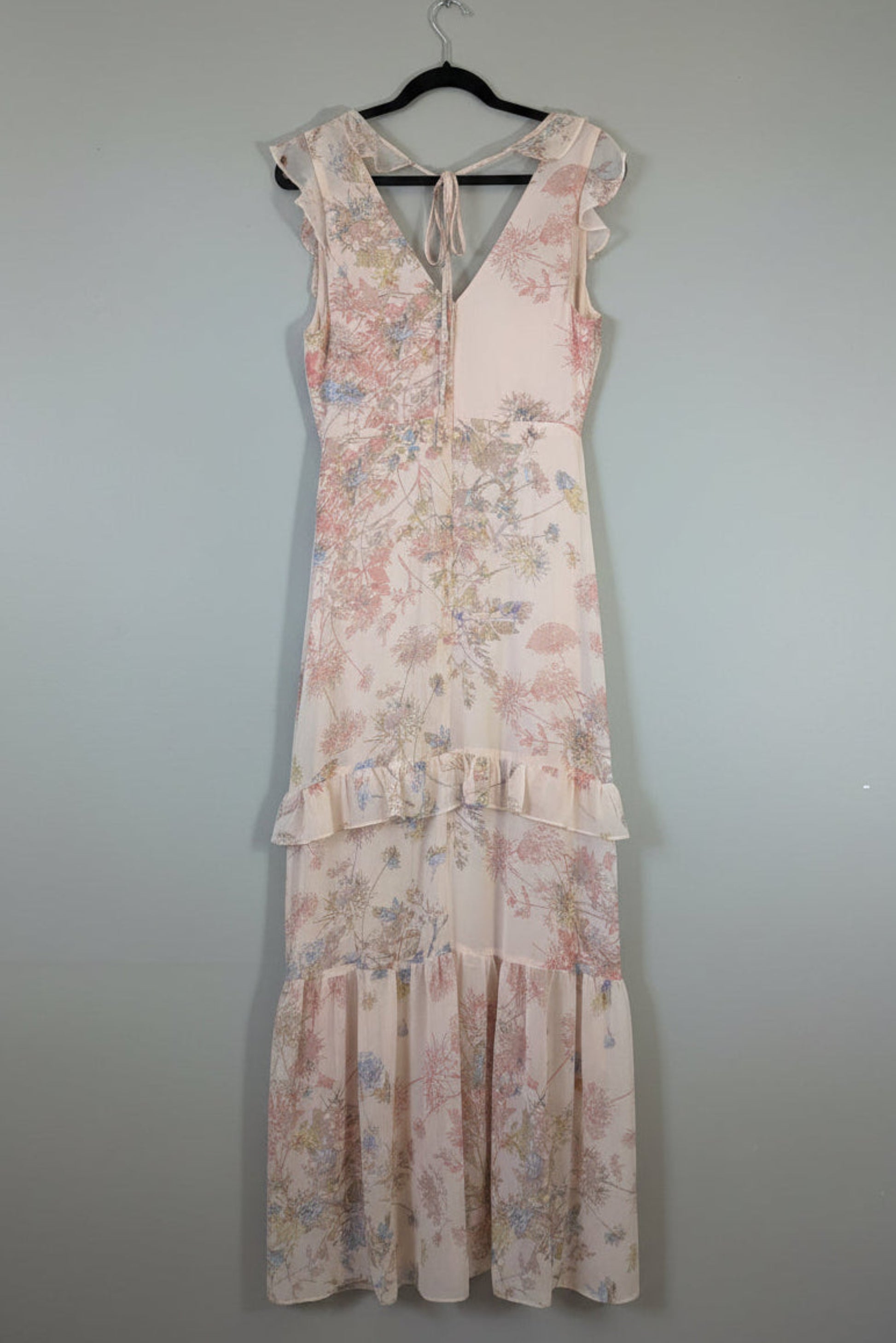 Back view of the pink floral BCBGMAXAZRIA dress, showing the elegant rear tie neck detail and hidden zipper closure.