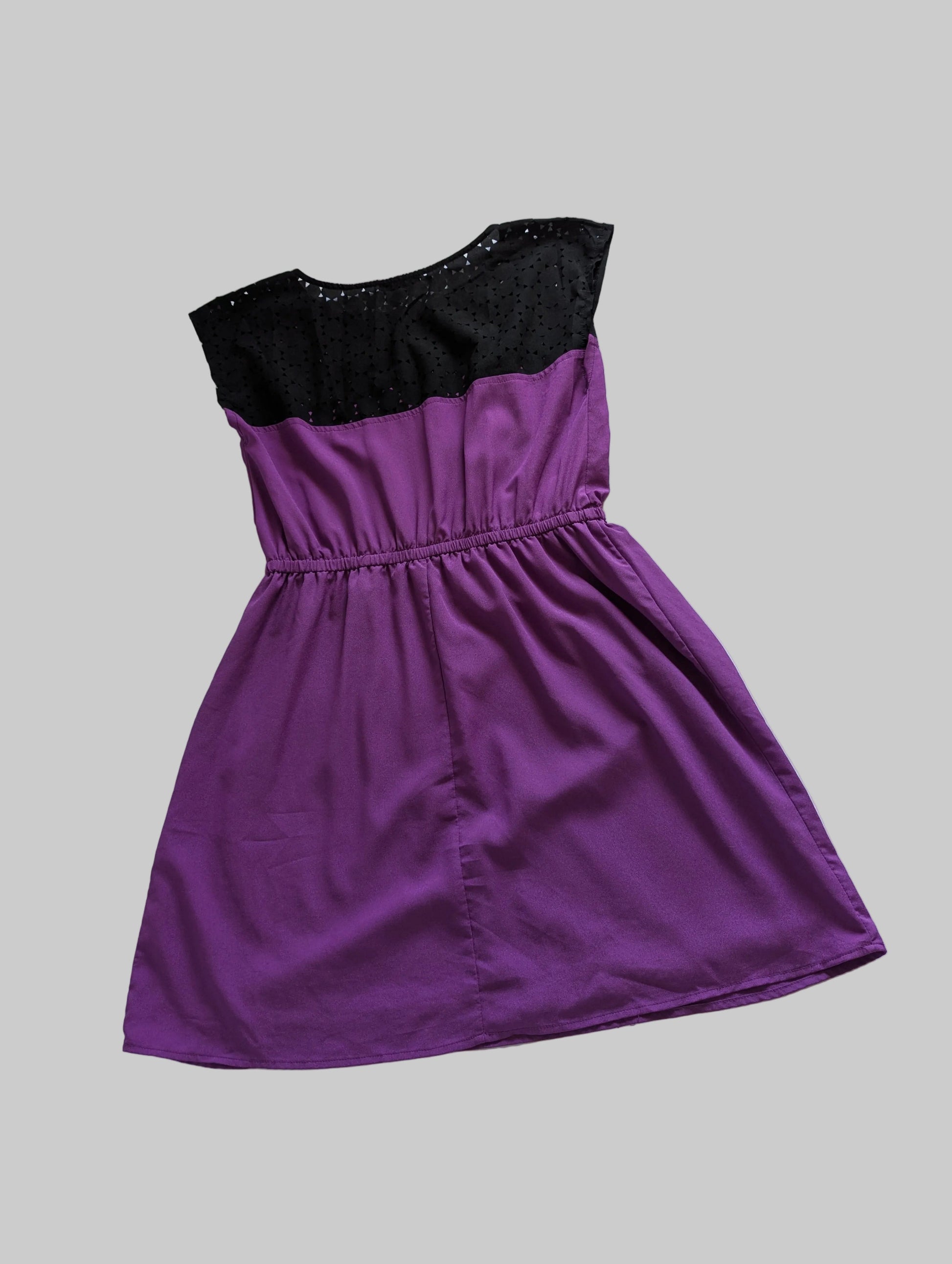 Back view of the purple sleeveless Bebop eyelet mini dress, showcasing the lightweight summer fabric and fit.
