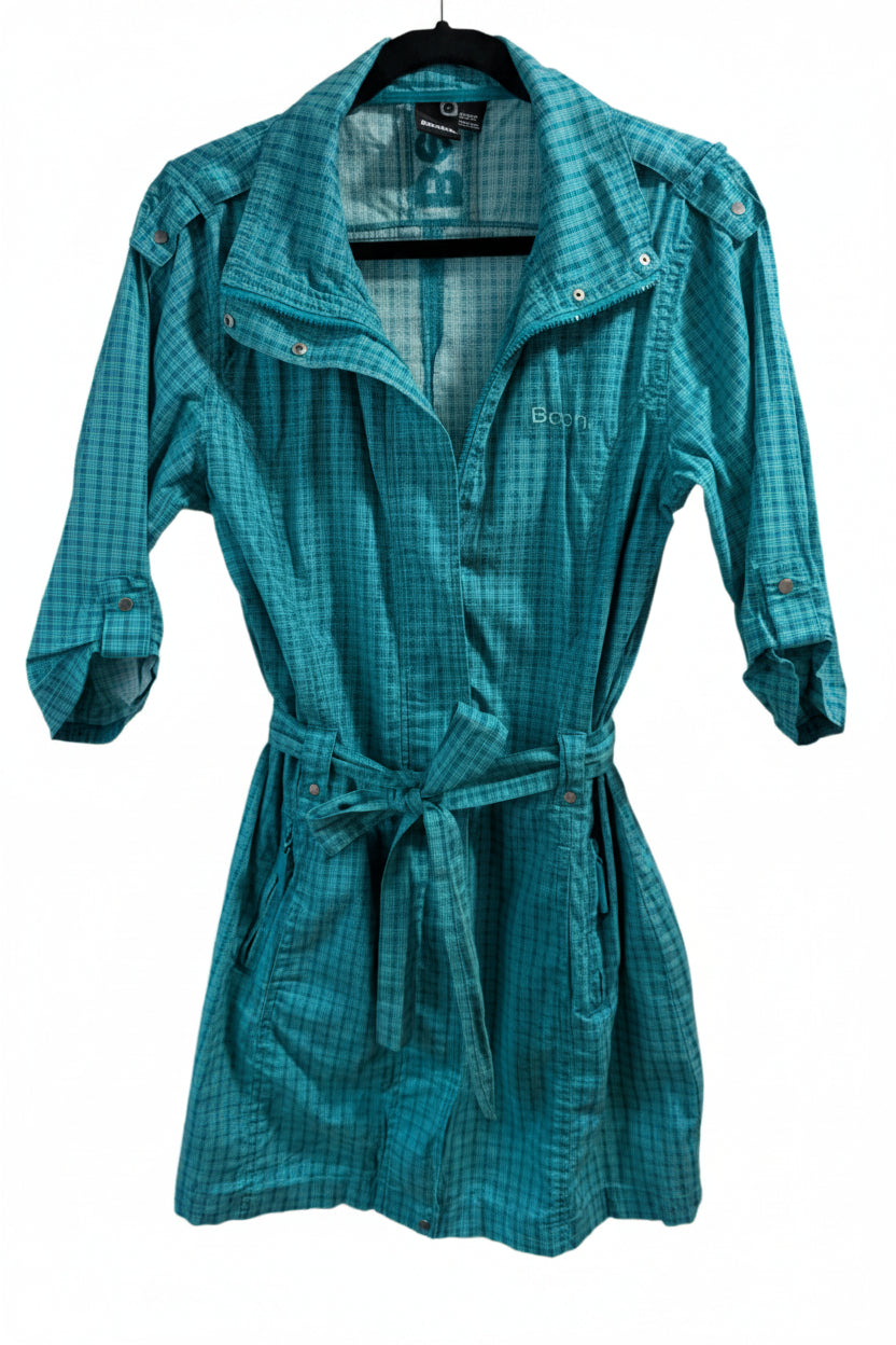 Front view of a long teal Bench lightweight cotton trench coat featuring a wrap silhouette, waist tie, and 3/4 sleeves.
