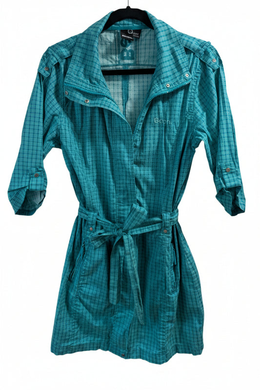 Front view of a long teal Bench lightweight cotton trench coat featuring a wrap silhouette, waist tie, and 3/4 sleeves.