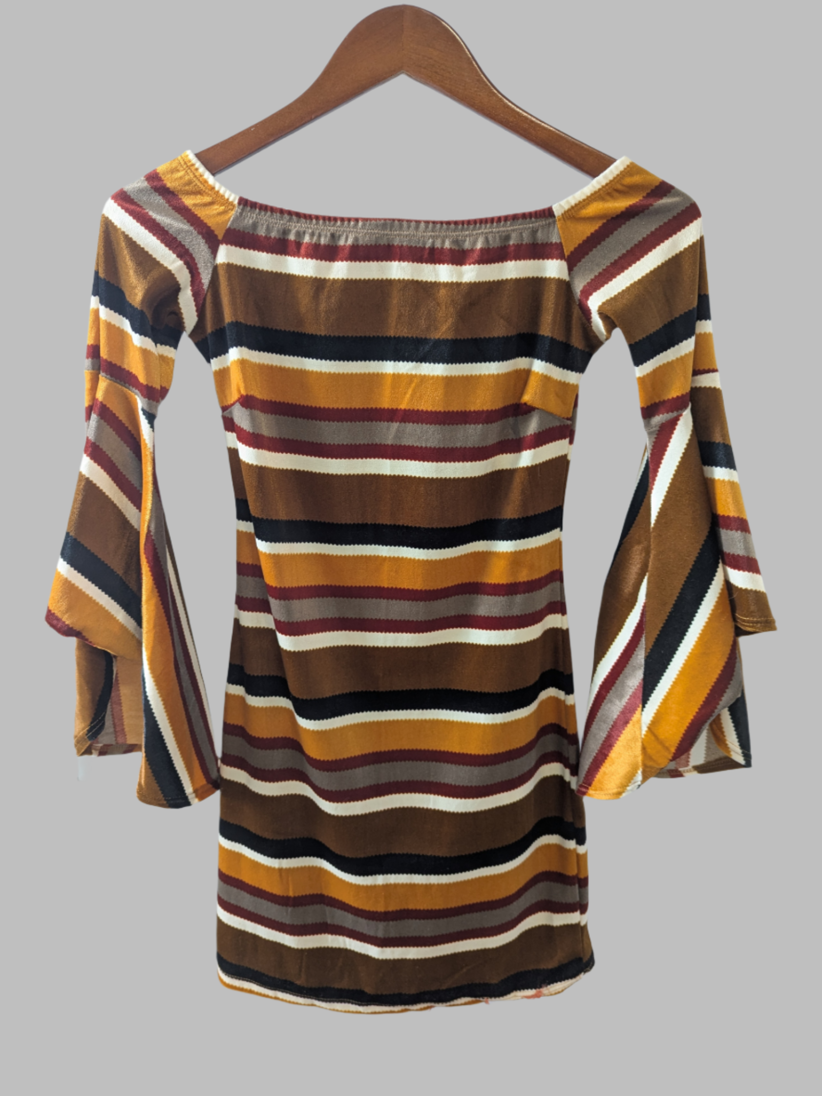 Front view of a multi-colored striped Diosa off-shoulder mini dress with bell sleeves hanging on a wood hanger.