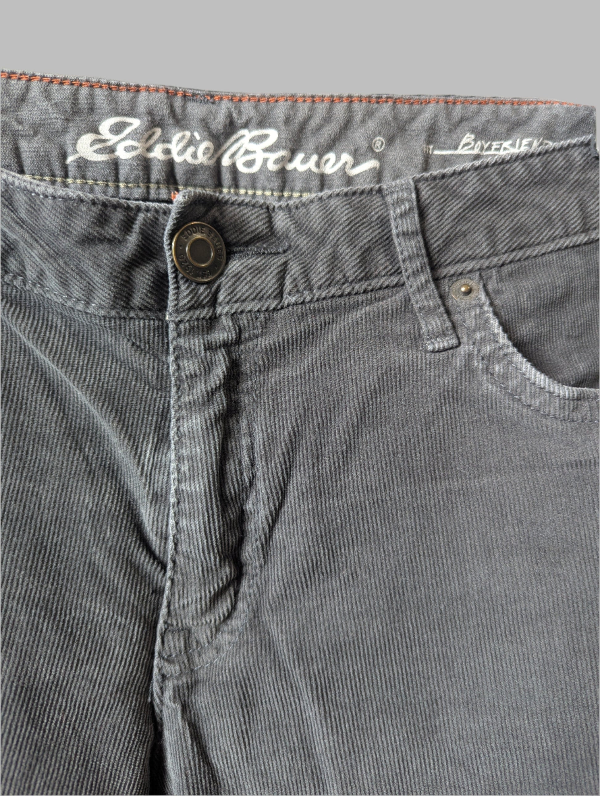 Close-up of the front pockets and zipper fly closure on the grey Eddie Bauer cords.