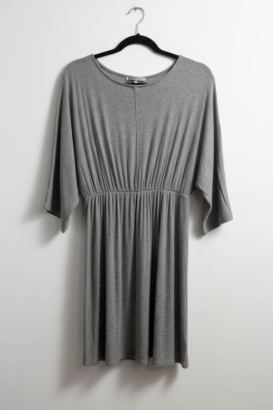 Close-up view of the round neckline and stretchy ribbed rayon fabric texture on the gray Emma's Closet dress.