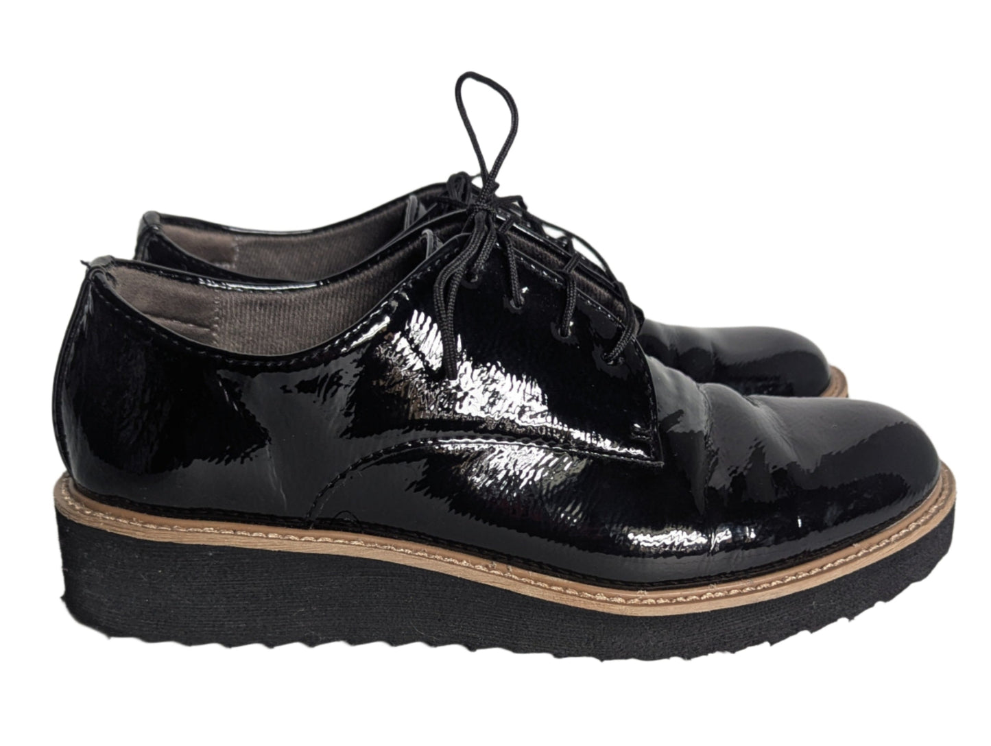 Side view of black EuroSoft patent leather oxford shoes featuring a lightweight platform sole and black lace-up closure.