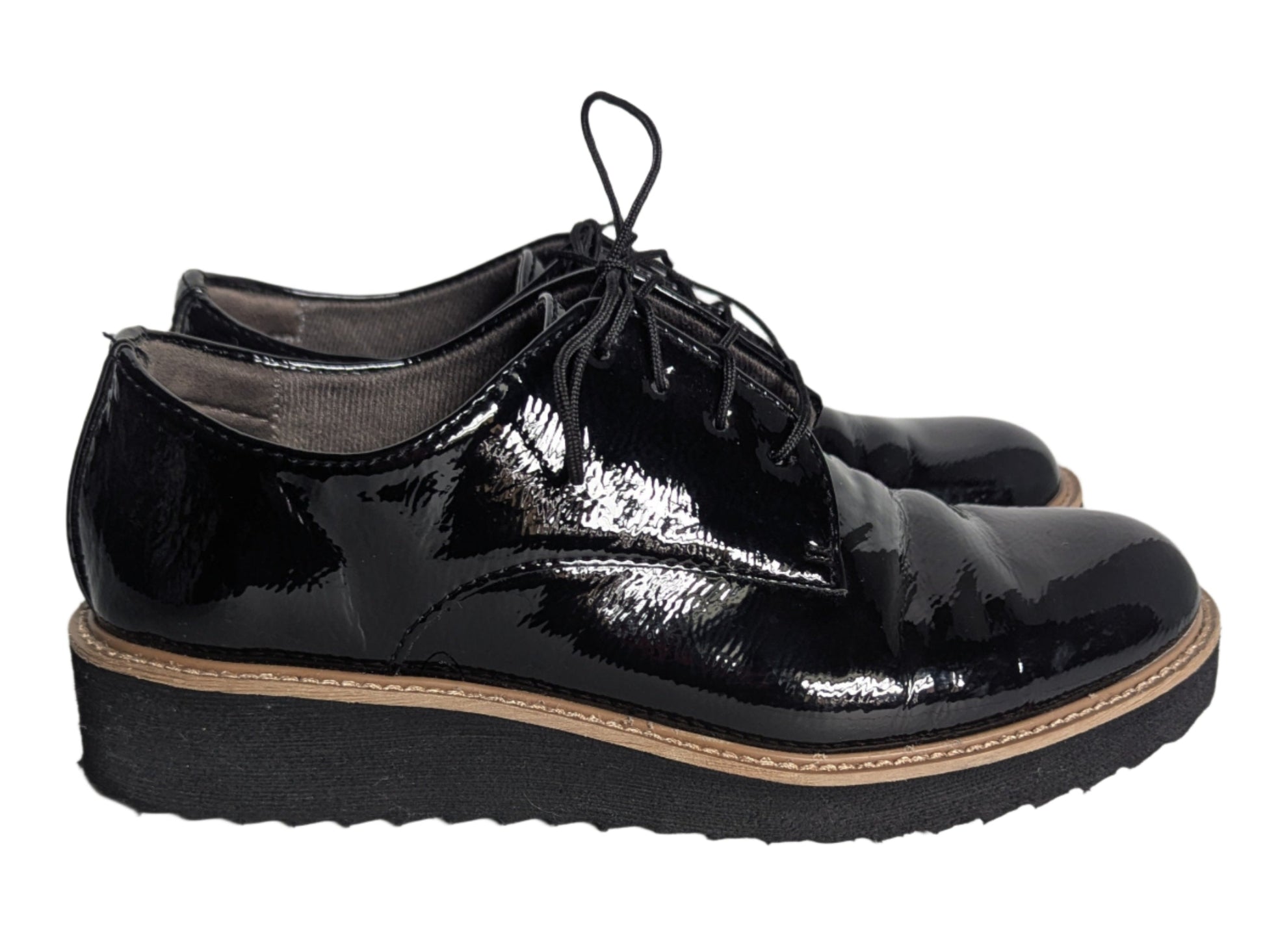 Side view of black EuroSoft patent leather oxford shoes featuring a lightweight platform sole and black lace-up closure.