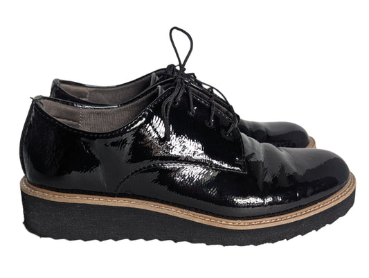 Side view of black EuroSoft patent leather oxford shoes featuring a lightweight platform sole and black lace-up closure.