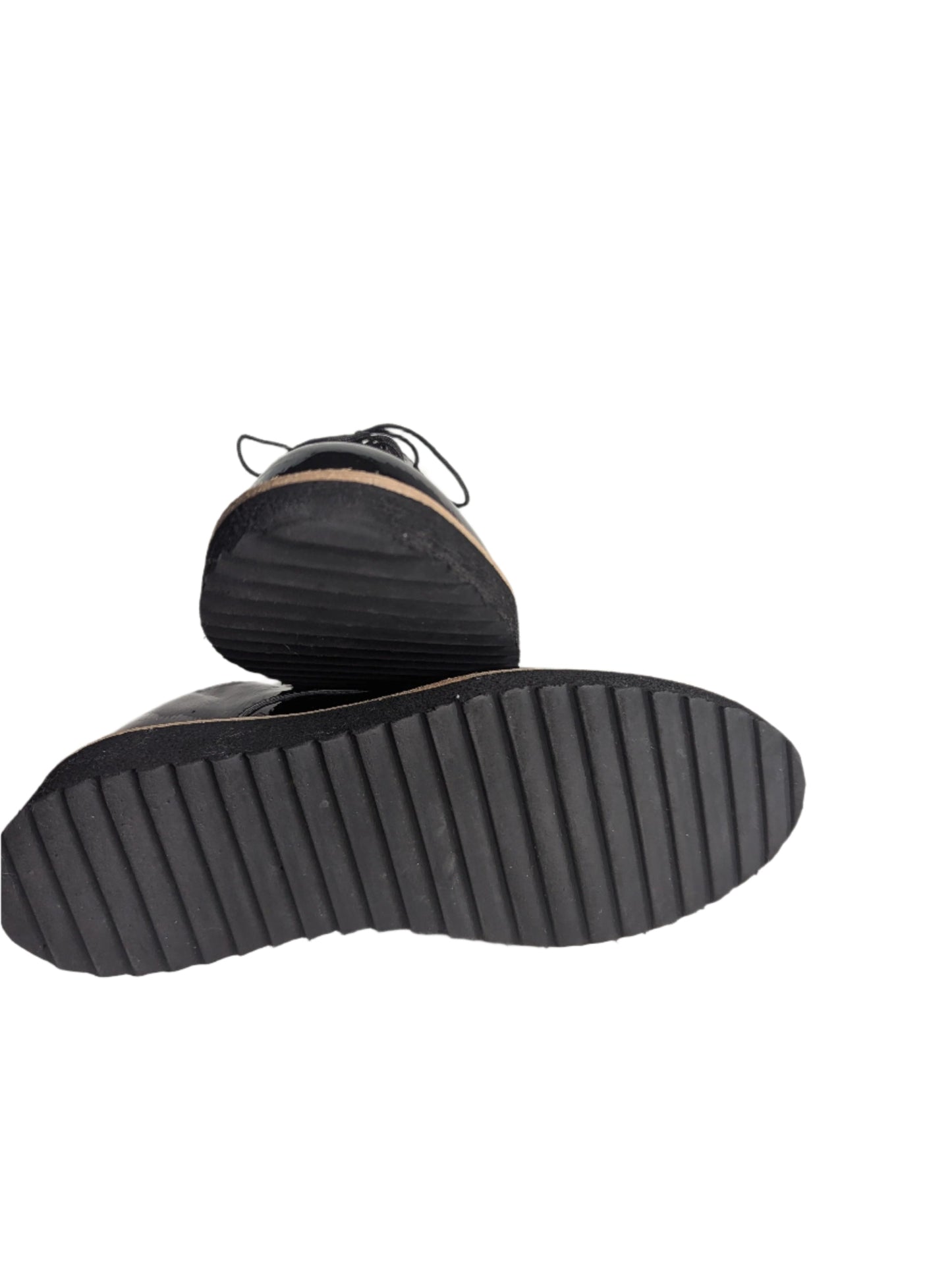 Angled profile view of a black EuroSoft patent oxford shoe, showcasing the lightweight foam midsole and textured grip.