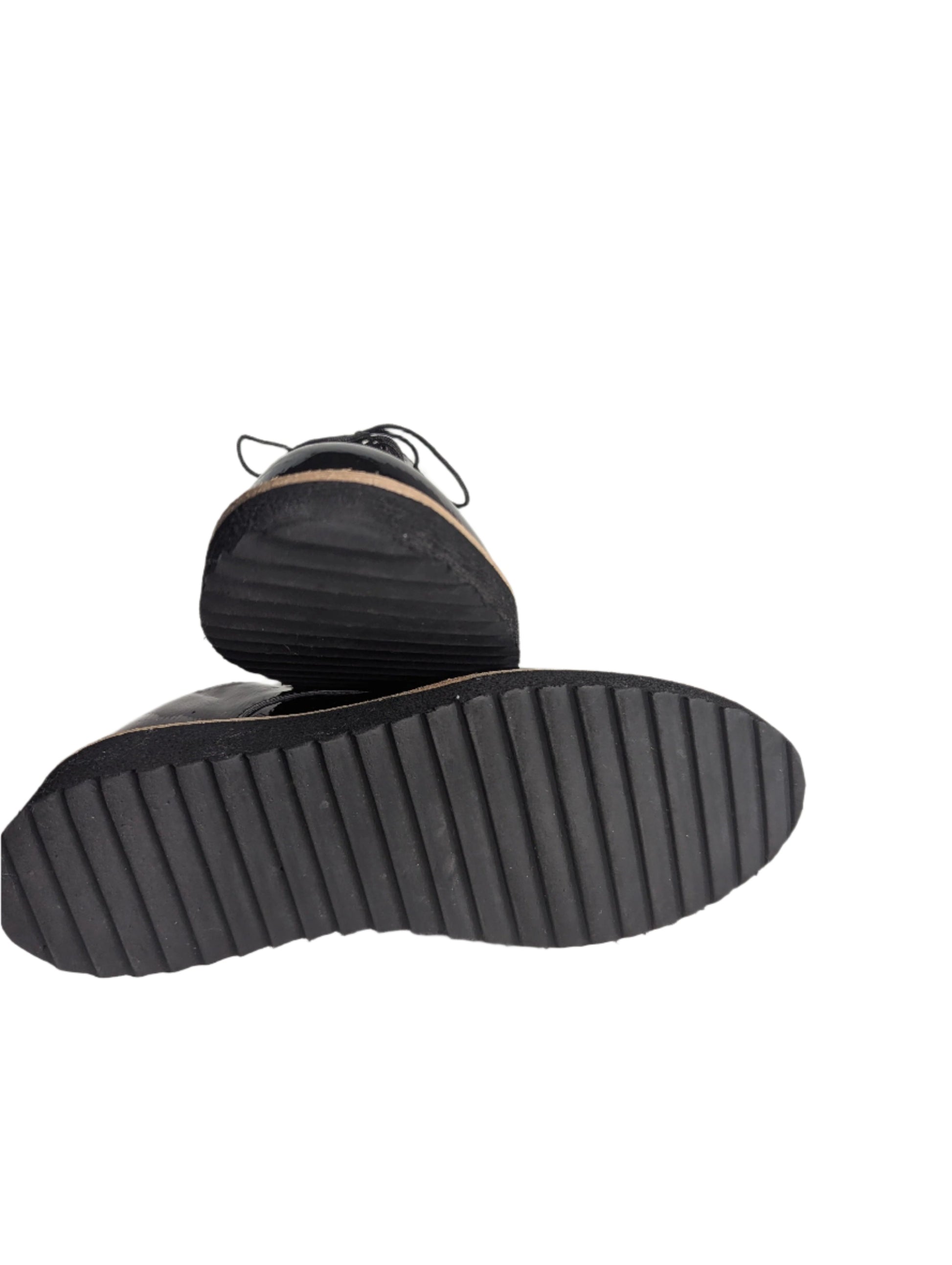Angled profile view of a black EuroSoft patent oxford shoe, showcasing the lightweight foam midsole and textured grip.