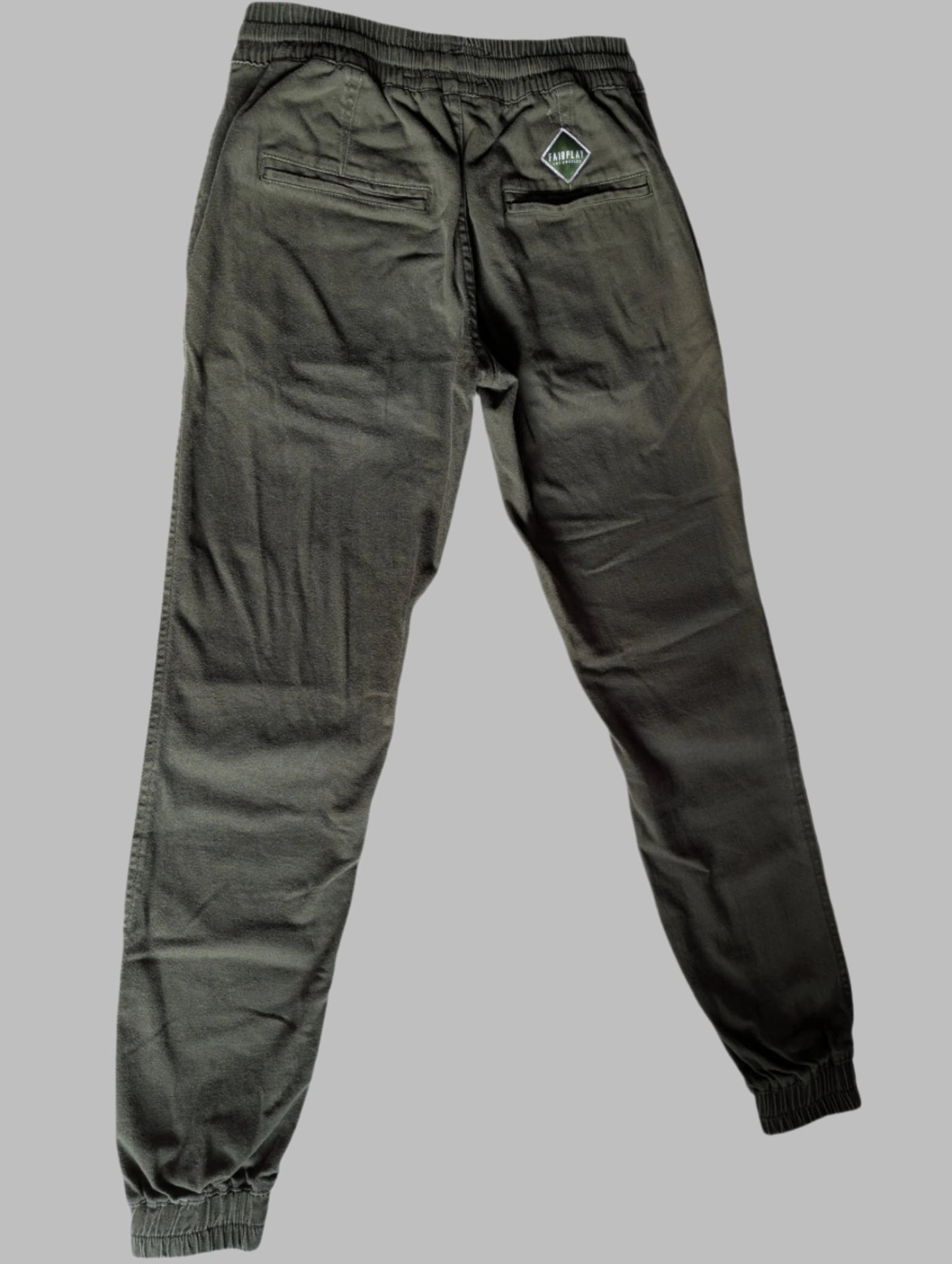 Back view of the green Fairplay cotton twill jogger pants showing the fit and pocket placement.