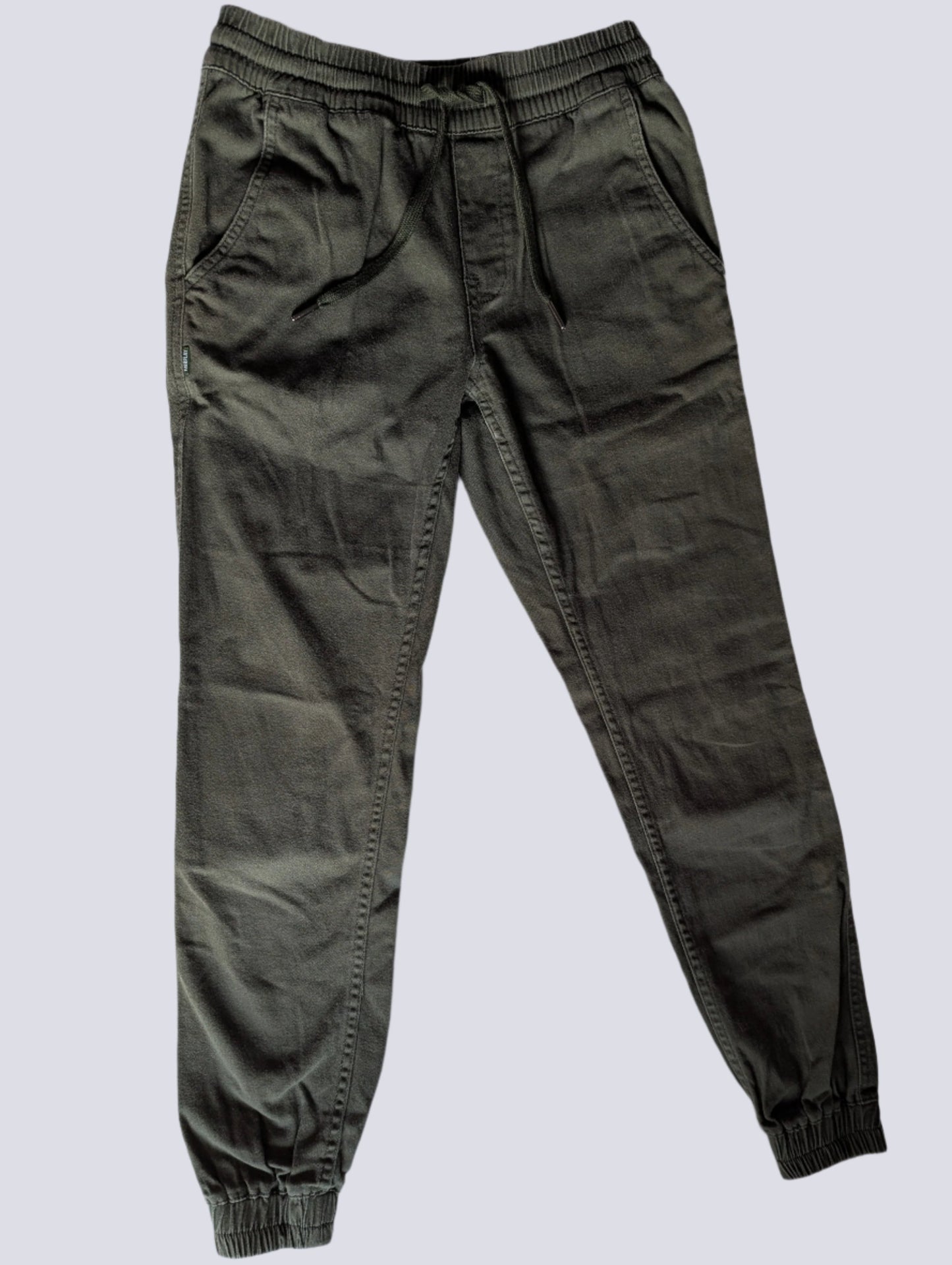 Front view of men's Fairplay Runner jogger pants in olive green cotton twill with an elastic waistband and tapered ankles.
