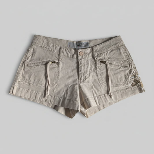 Front view of khaki tan Guess mini shorts featuring an embroidered waistband design and front zipper pockets.