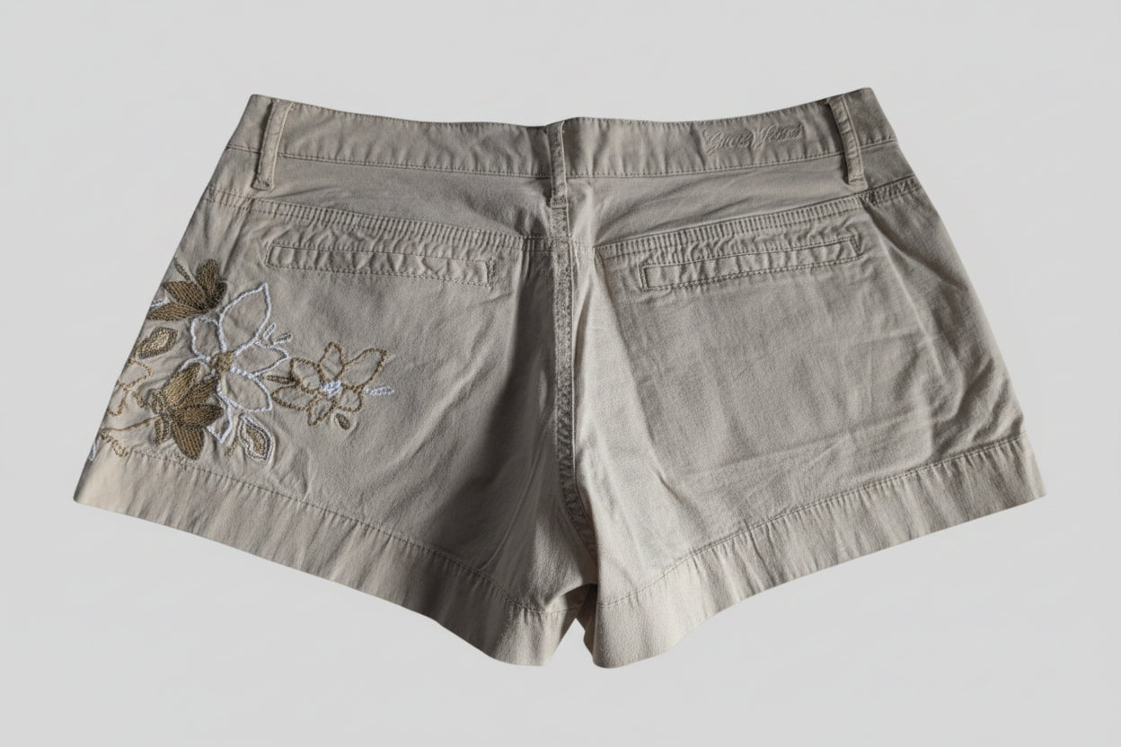 Back view of the low rise Guess khaki shorts, showcasing the clean fit and tailored back pockets