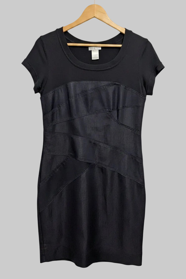 Front view of a London Times dark denim midi pencil dress with a black short sleeve top hanging on a hanger.