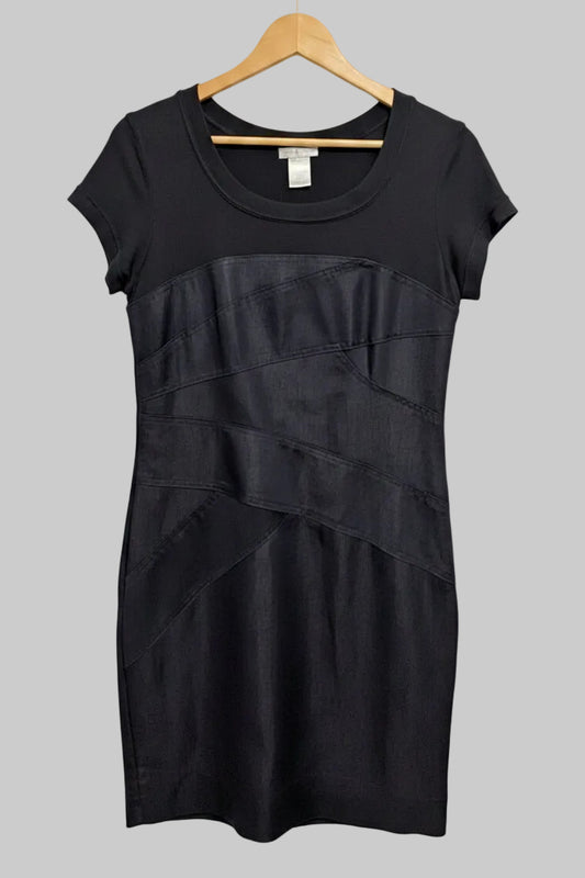 Front view of a London Times dark denim midi pencil dress with a black short sleeve top hanging on a hanger.