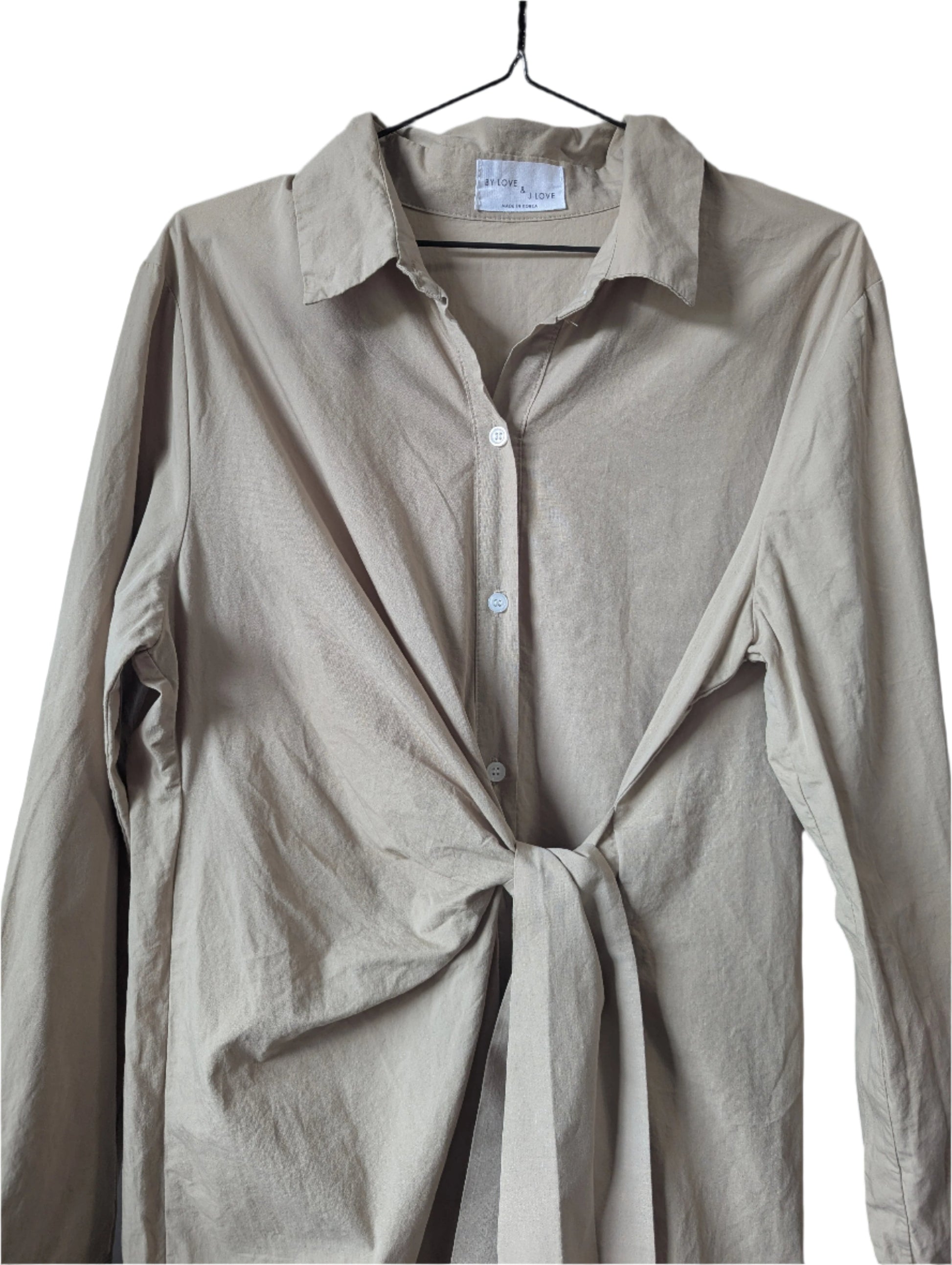 Detailed close-up view of the front button-down closure and flattering attached waist tie on the khaki Love and J Love dress.