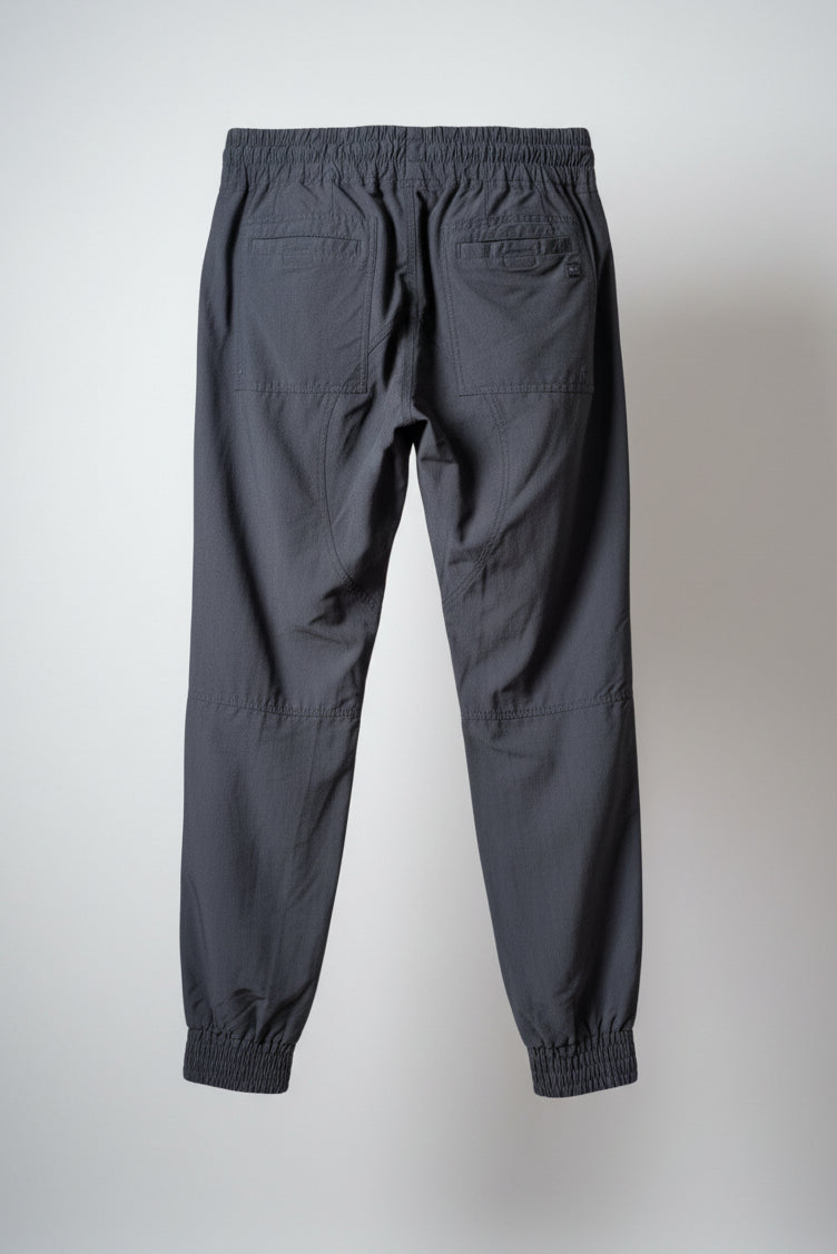 Back view of the black MEC trek pants showcasing the regular casual fit.