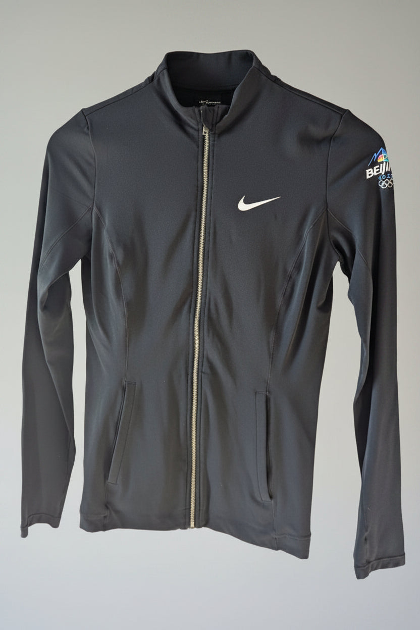 Front view of a black Nike Yoga Dri-Fit full zip athletic jacket