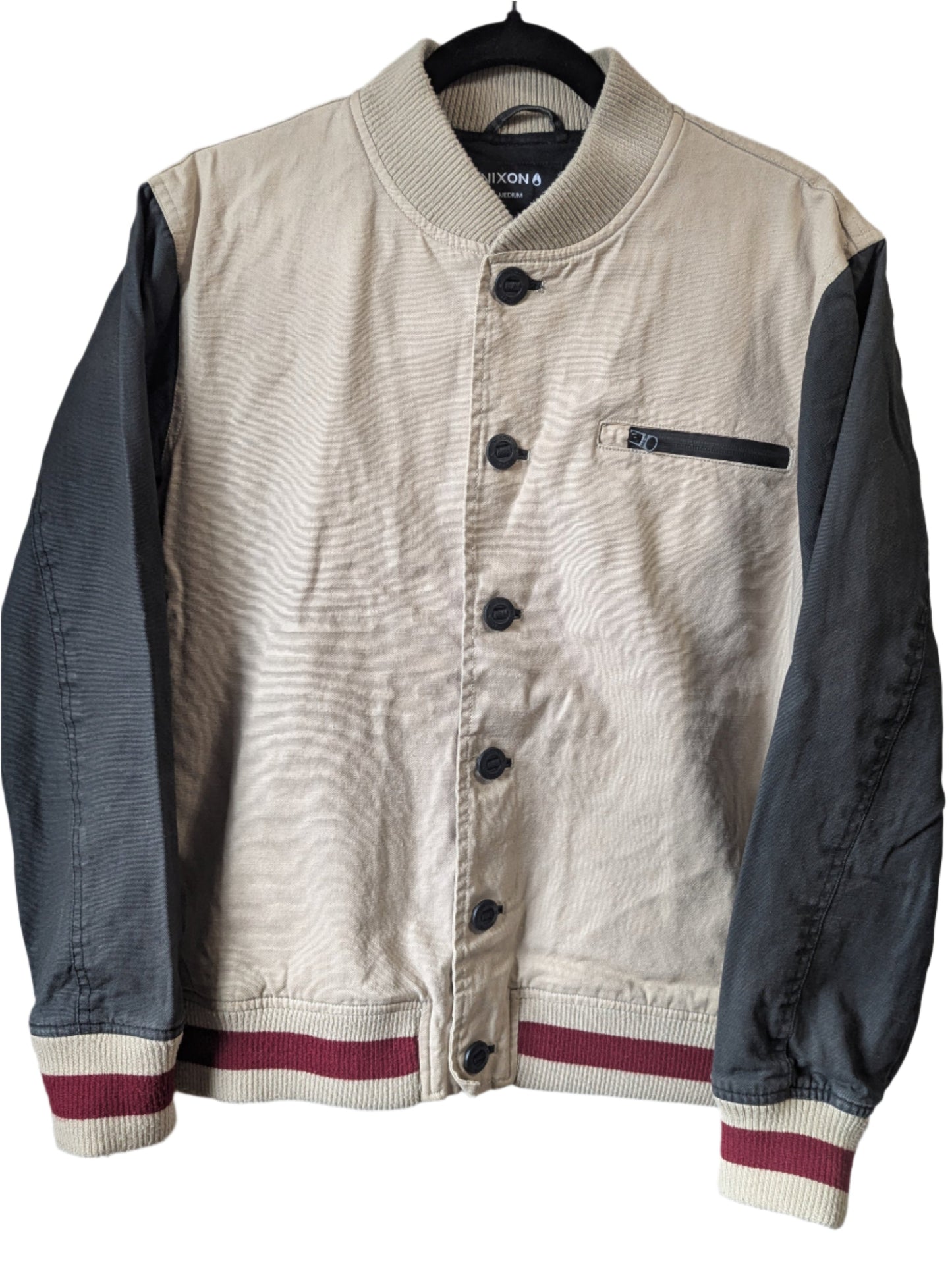 Front view of a men's Nixon University campus varsity jacket featuring a beige cotton body with charcoal grey sleeves and maroon knit trim.