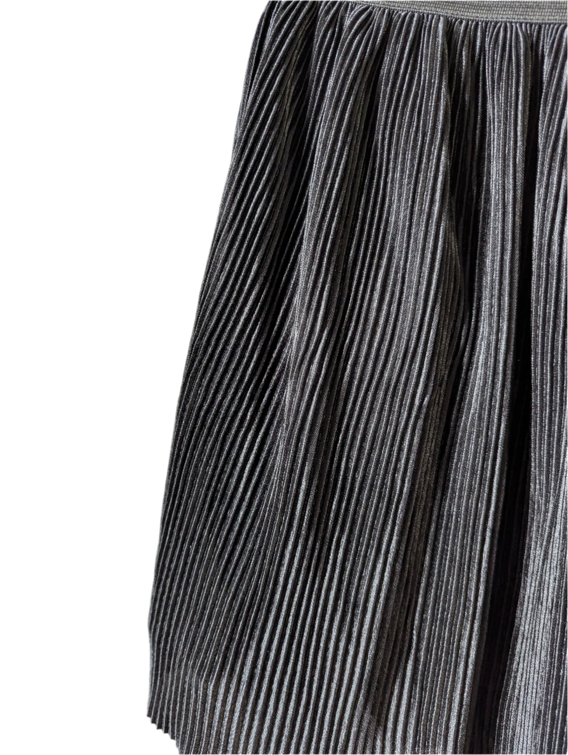 Close-up detail of the crisp pleating and subtle glossy sheen on the black Old Navy polyester mini skirt.