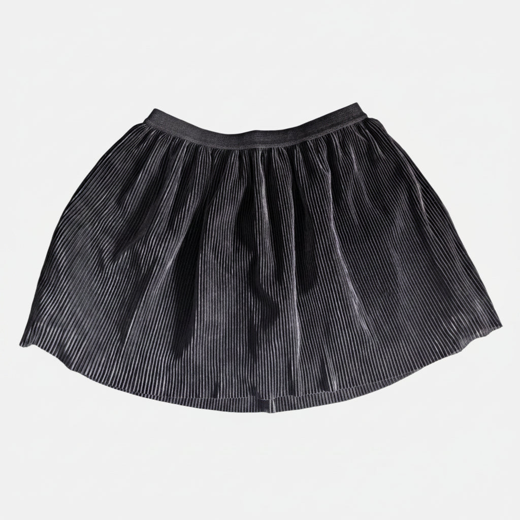 Flat lay view of the black Old Navy pleated tennis-style mini skirt showing the waistband and structure