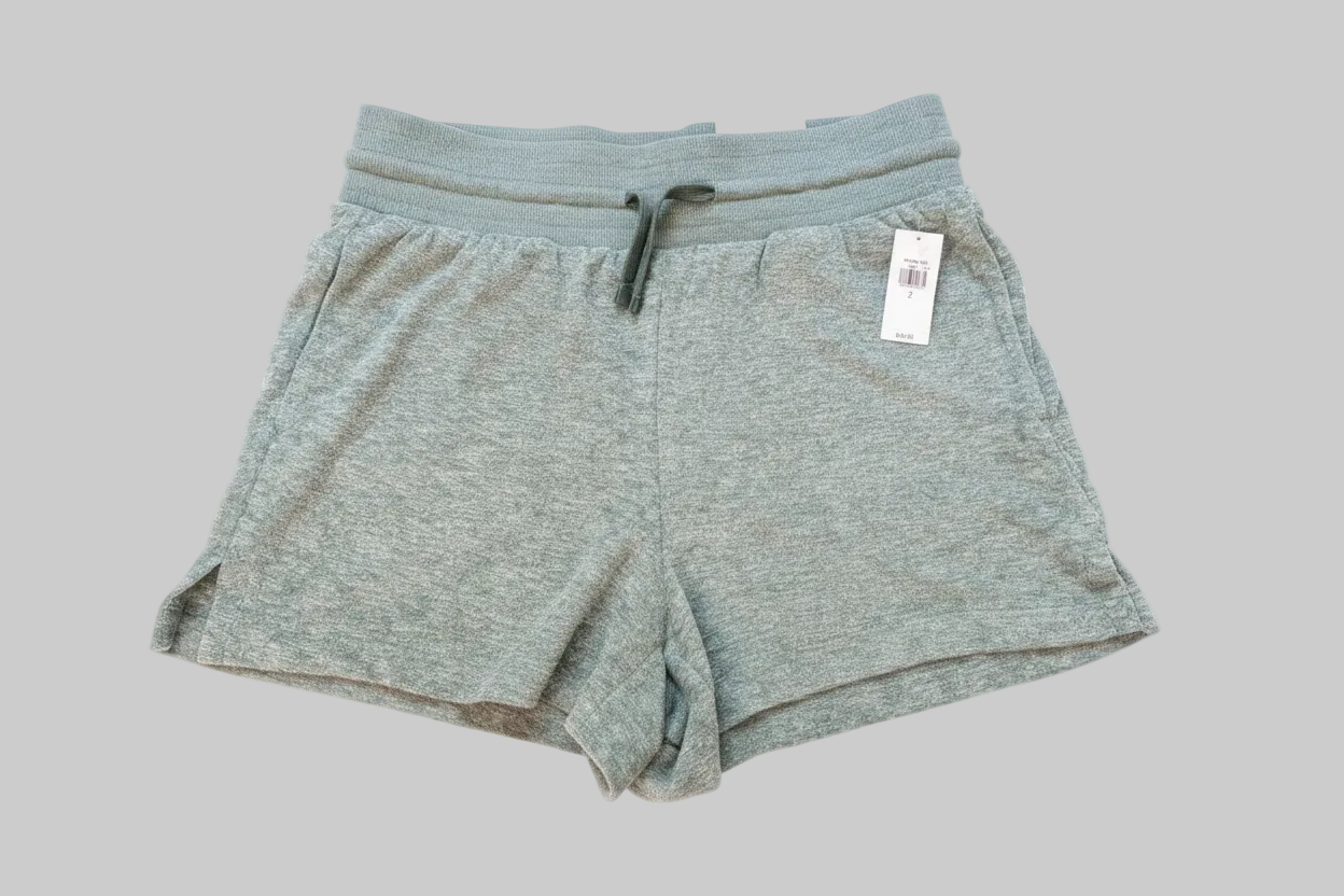 Front view of seafoam green high-waisted terrycloth Old Navy shorts with original tags attached