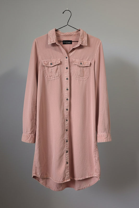 Front view of a salmon pink Parasuco Tencel button-up midi shirt dress hanging on a hanger.