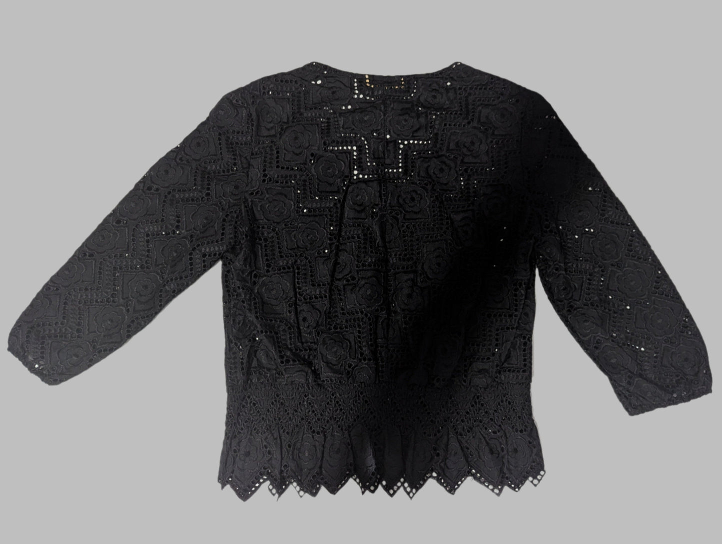 Flat lay back view of the black cotton-silk blend Qian Zijin peplum blouse showing the full 3/4 sleeve silhouette.