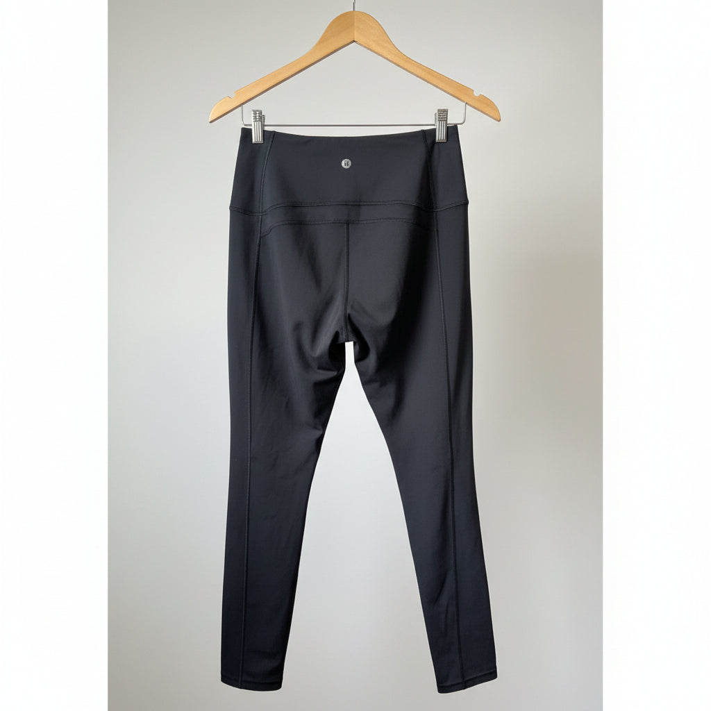 Back view of the black Queenie Ke yoga pants, showcasing the supportive high waistband and clean stitching.