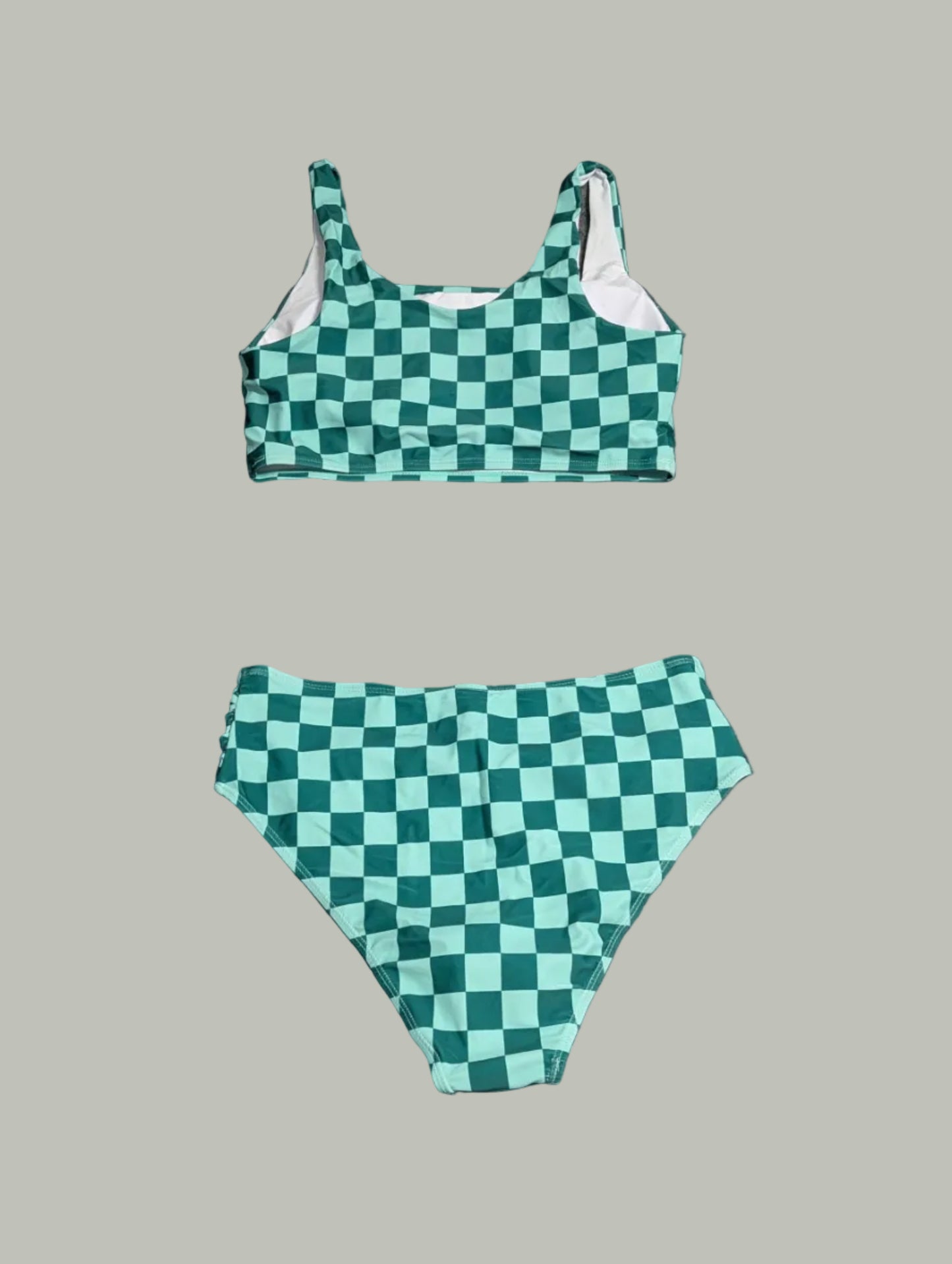 Full view of the matching green checkered bikini top and bottoms, showcasing the high-stretch summer swimwear fabric and clean lining.
