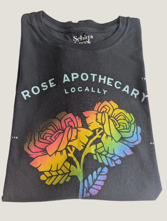Close-up view of the printed rainbow floral Rose Apothecary locally sourced graphic on the grey t-shirt.
