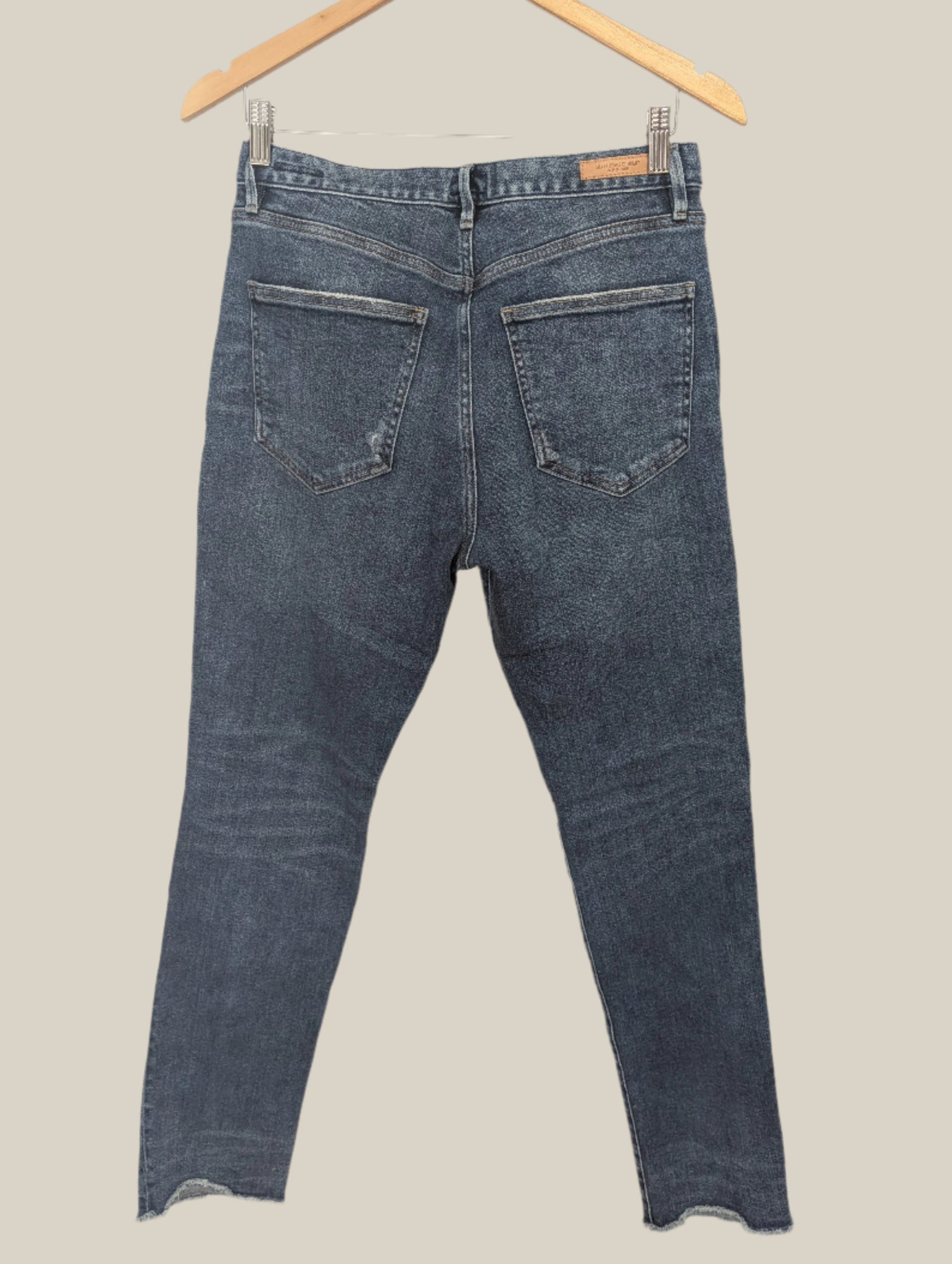 Back view of the blue distressed Silver Jeans Maryland highlighting the rear pockets and high rise fit.