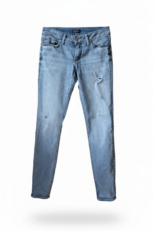 Front view of women's Silver Jeans Suki skinny light wash distressed denim pants