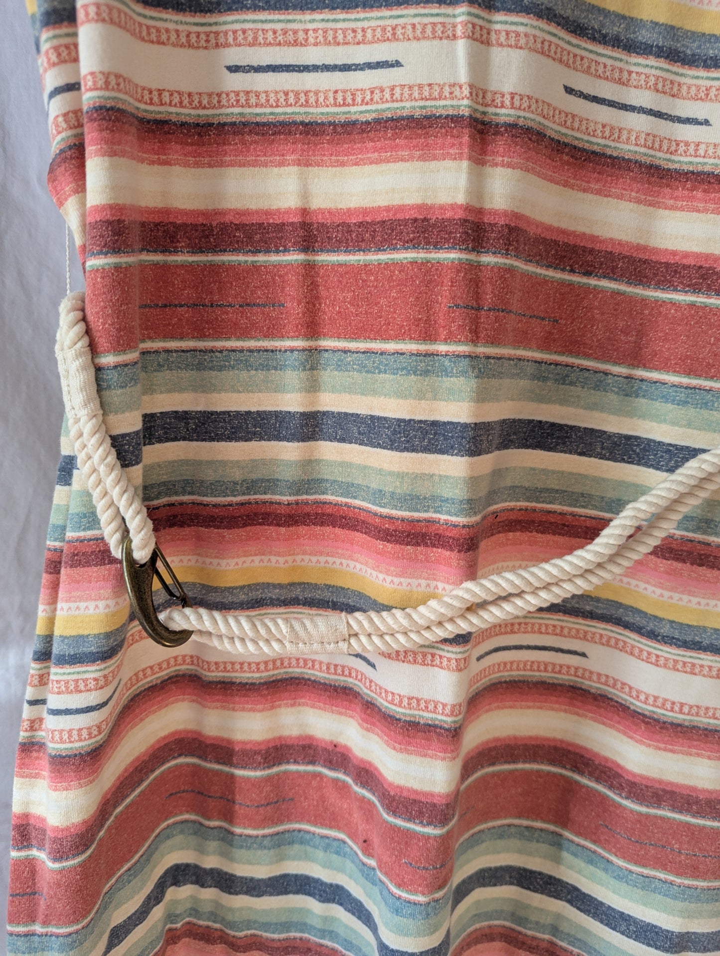 Close-up view of the vibrant horizontal stripes and the woven white accent rope belt tied around the waist of a curated Ralph Lauren casual dress.