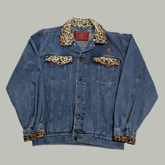 Front full-length view of a vintage blue denim trucker jacket with custom Las Vegas Riviera Hotel embroidery, channeling a 90s streetwear aesthetic