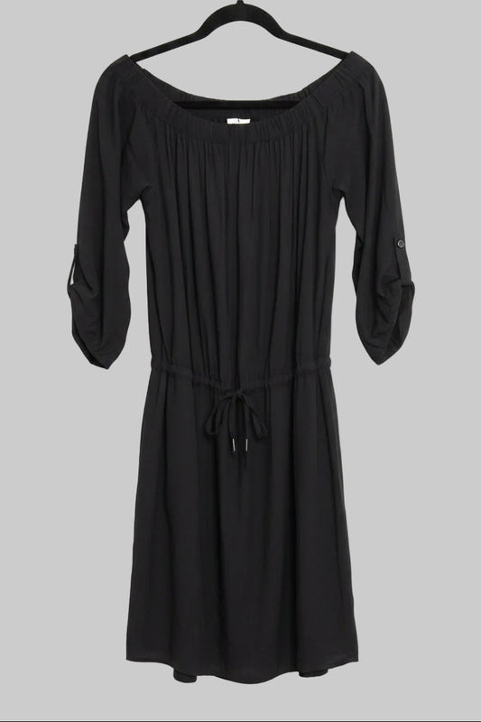Front view of a black Lole Jamie off-the-shoulder midi dress with a tie waist hanging on a hanger against a gray background.